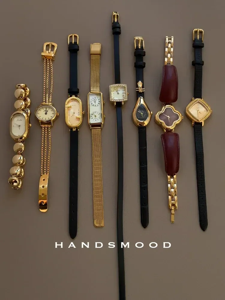 Elegant women's and men's gold and leather strap watches for luxury style.