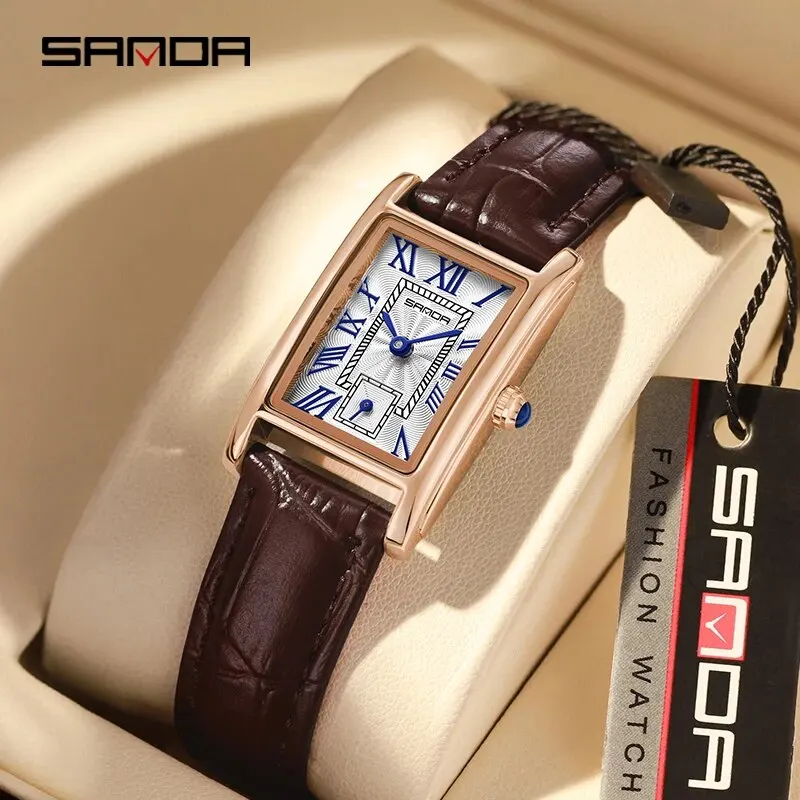 Luxury rectangular wristwatch with blue Roman numerals and leather strap.