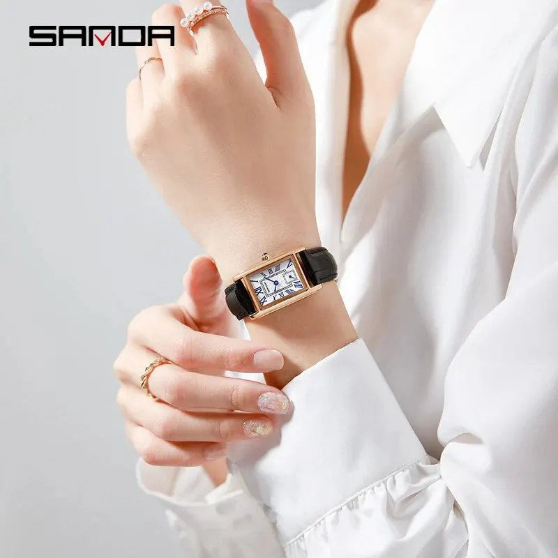 Luxury women's leather strap watch with Roman numeral dial, perfect for elegant outfits.