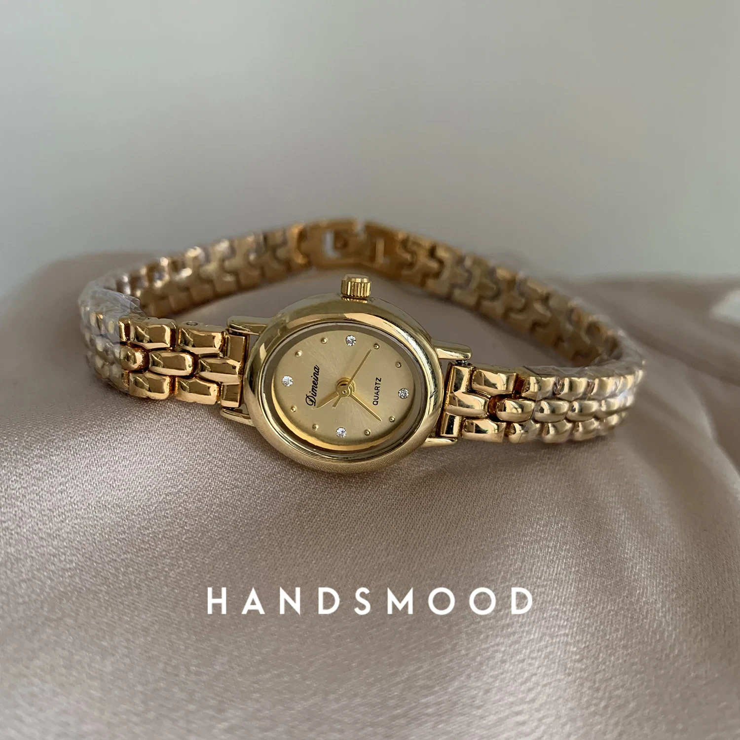Luxurious gold women's wristwatch with crystal dial, ideal for elegant jewelry and accessories.