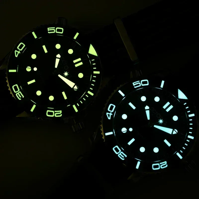 Glow-in-the-dark watch dials with luminescent markers.