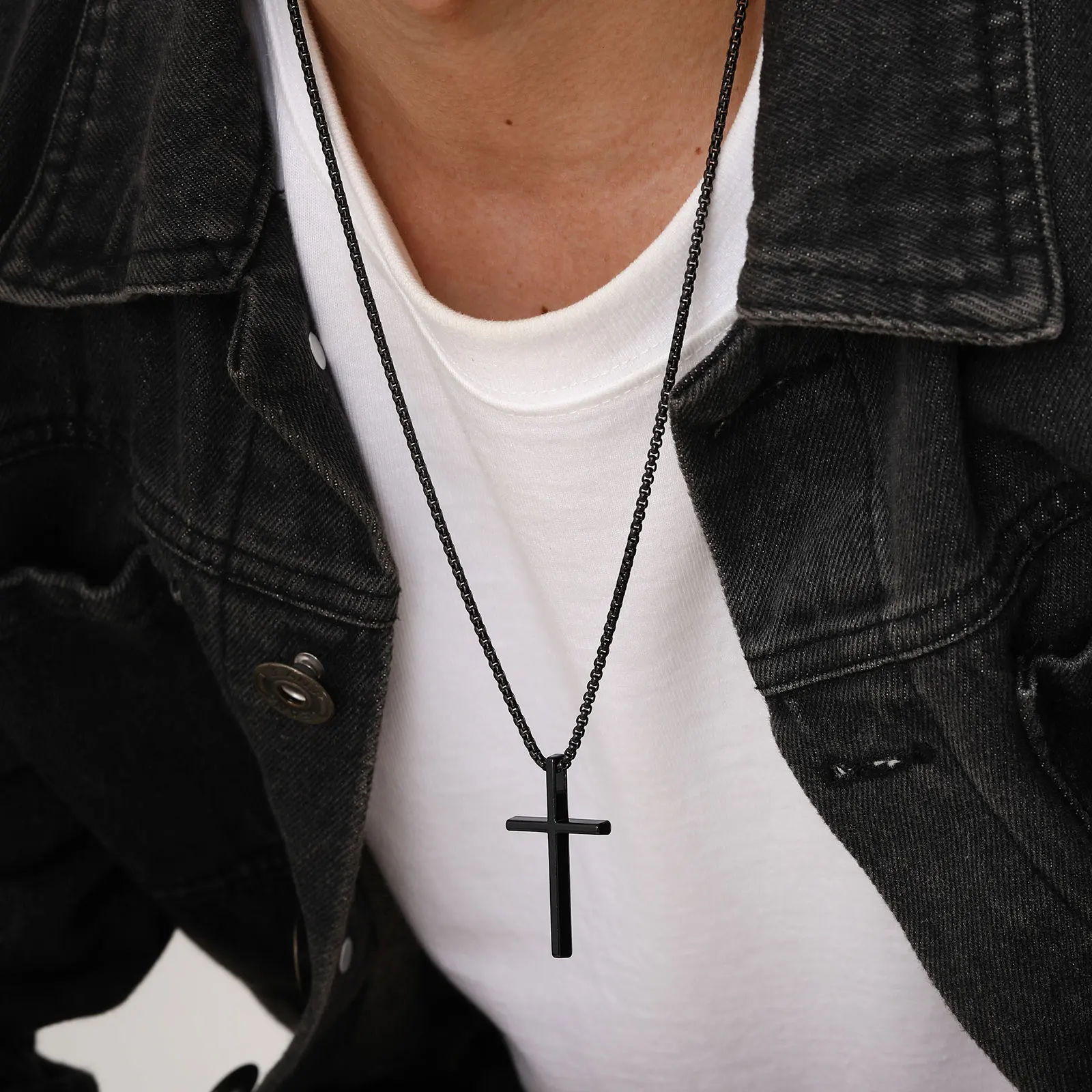 Elegant black cross pendant on a matching chain, perfect for everyday or statement jewelry.