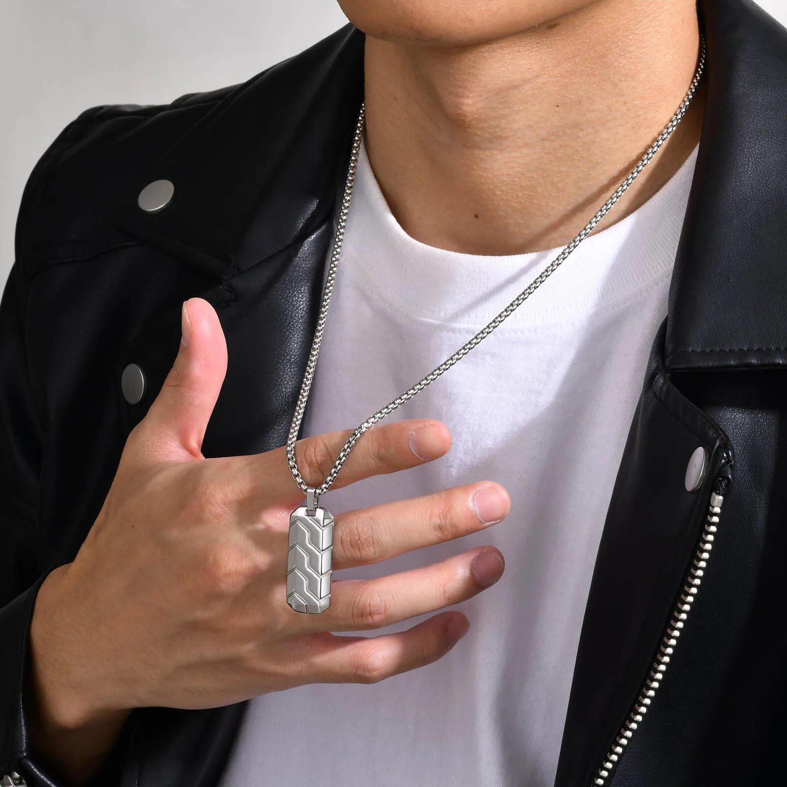 Silver chain with a sleek, modern dog tag pendant. Perfect for casual and stylish jewelry looks.