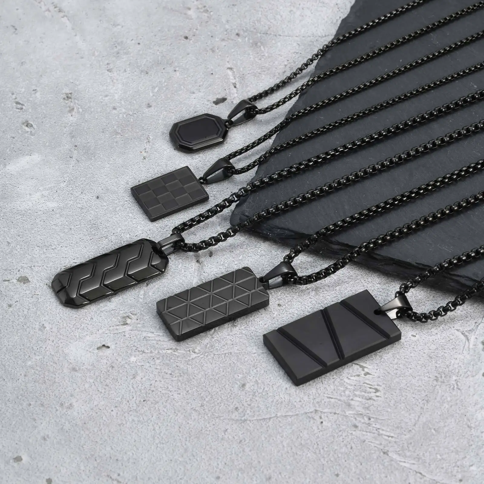 Stylish black pendant necklaces with geometric designs for modern men and women. Perfect for everyday wear or special occasions.