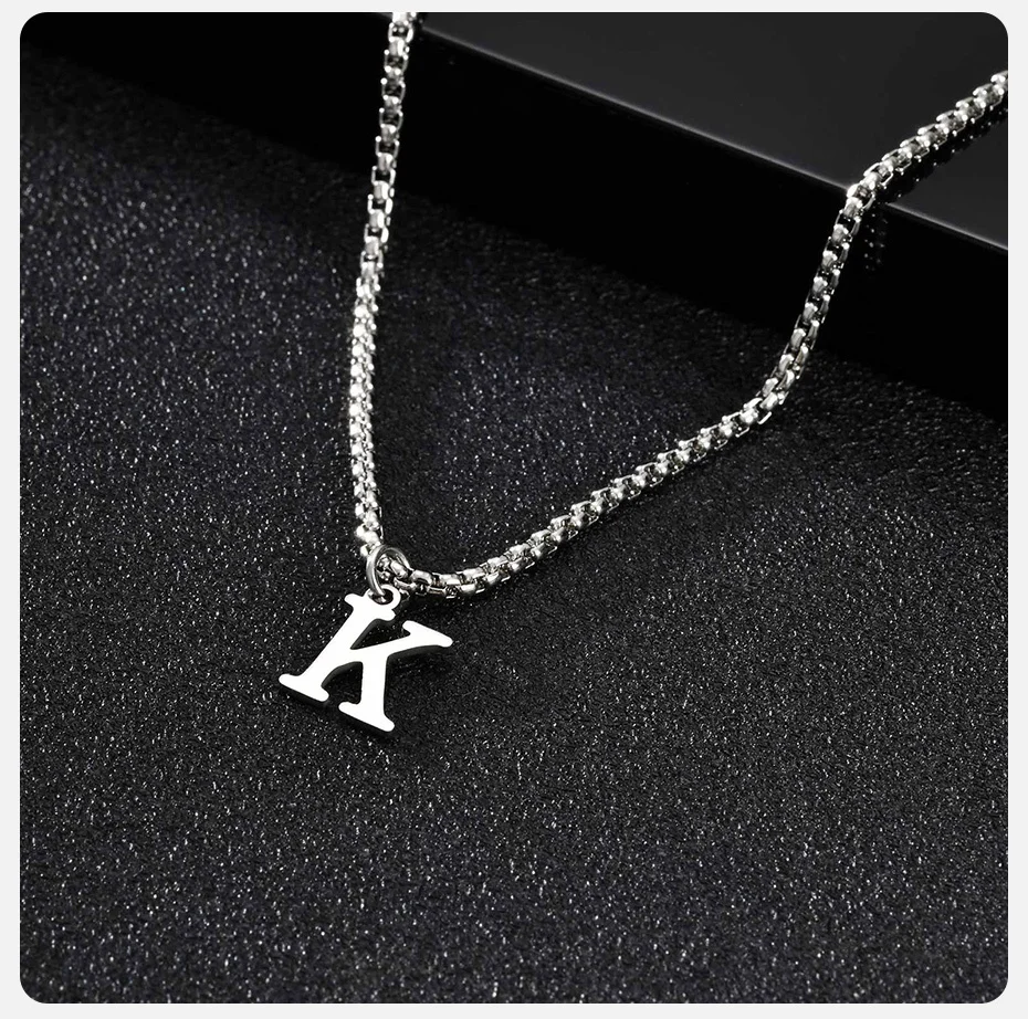 Silver initial jewelry necklace with letter X pendant.