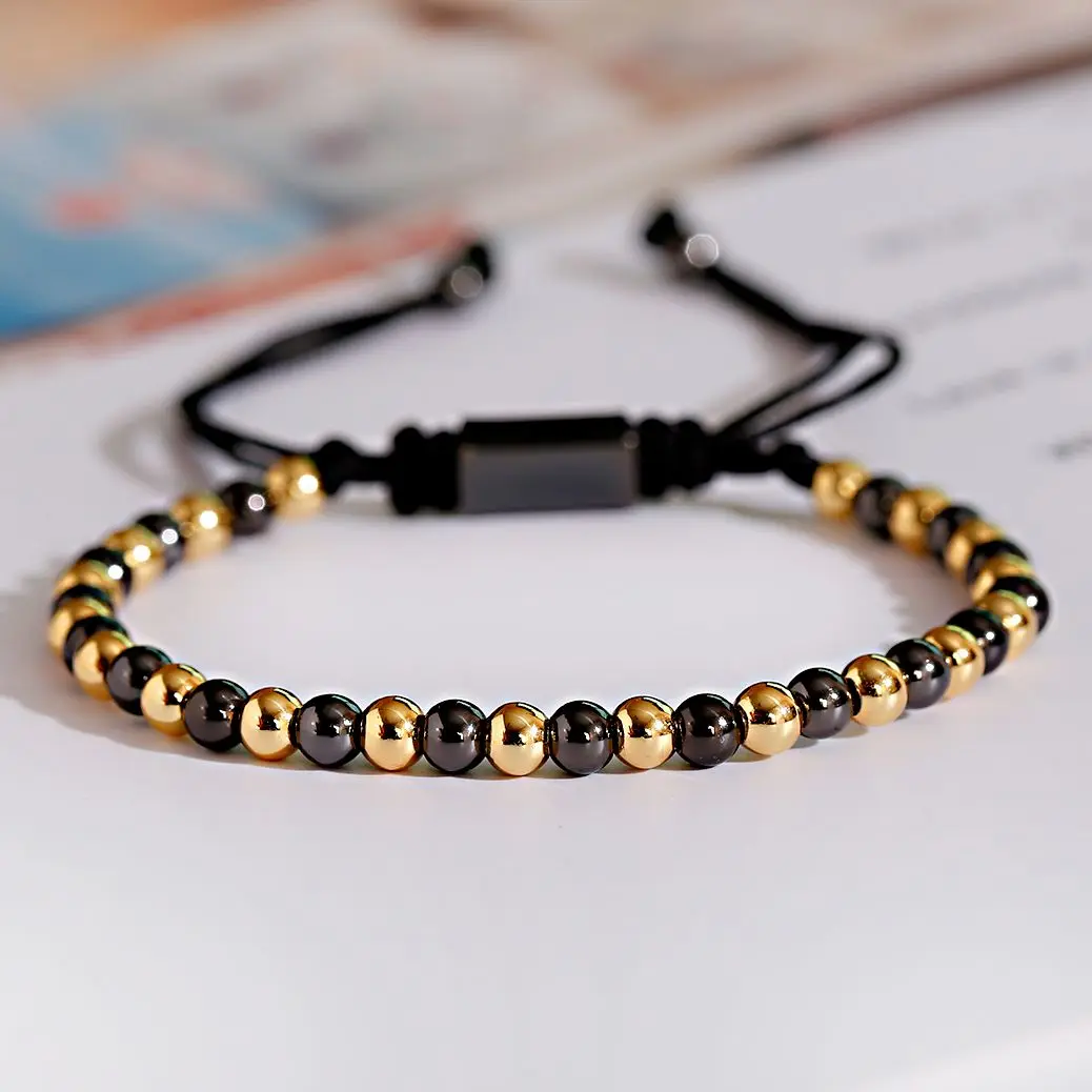 Elegant black and gold bead bracelet, stylish unisex jewelry for casual or formal wear.
