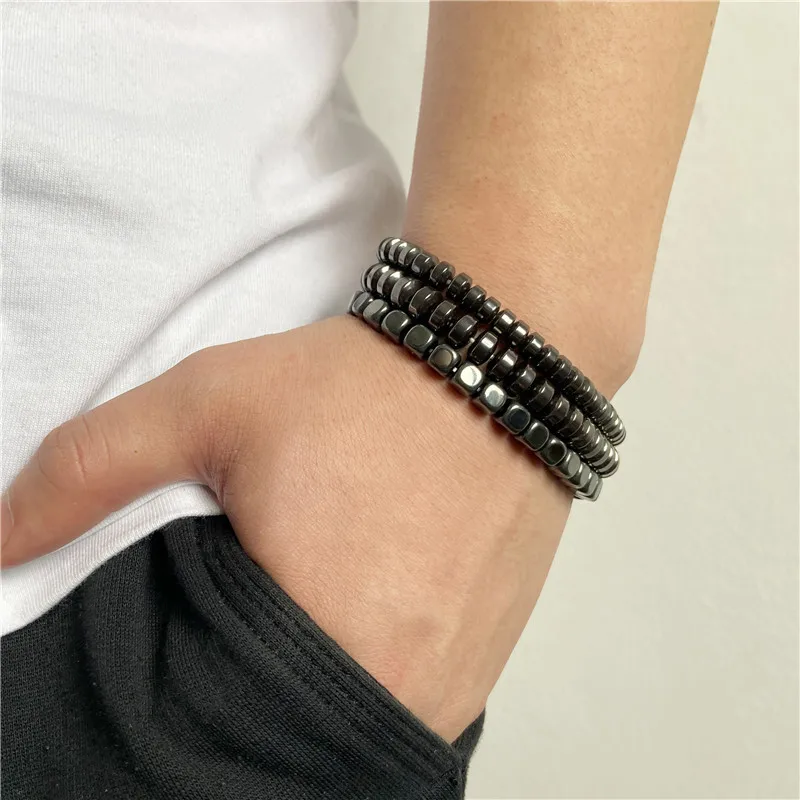 Beaded black gemstone stackable bracelet set for men and women, trendy jewelry accessory.