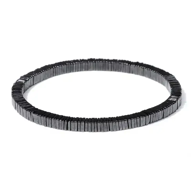 Black beaded bracelet featuring sleek, uniform beads for a modern, versatile look. Perfect for casual or elegant outfits.