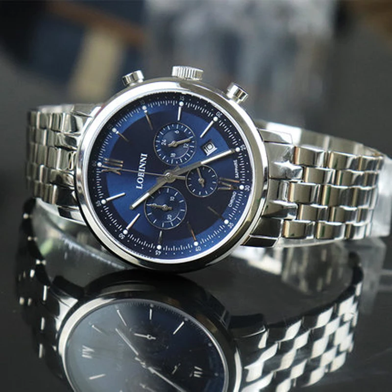 Luxury men's quartz watch with blue dial and stainless steel band.