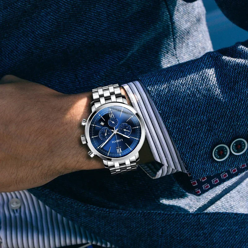 Stainless steel men's wristwatch with blue dial, chronograph features, perfect for stylish occasions.
