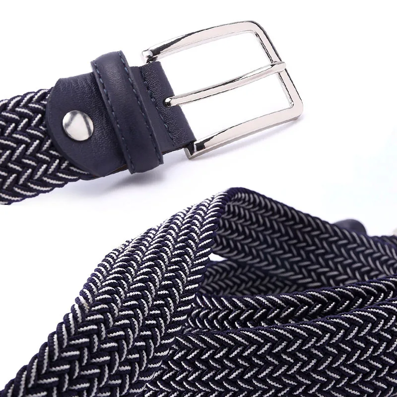 Premium woven fabric belt with leather trim and sleek silver buckle, perfect for stylish outfits.