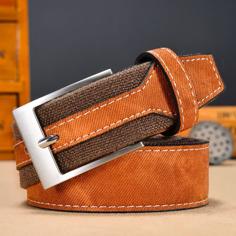 Durable brown and orange fabric belt with silver buckle for everyday wear. Stylish and functional accessory.