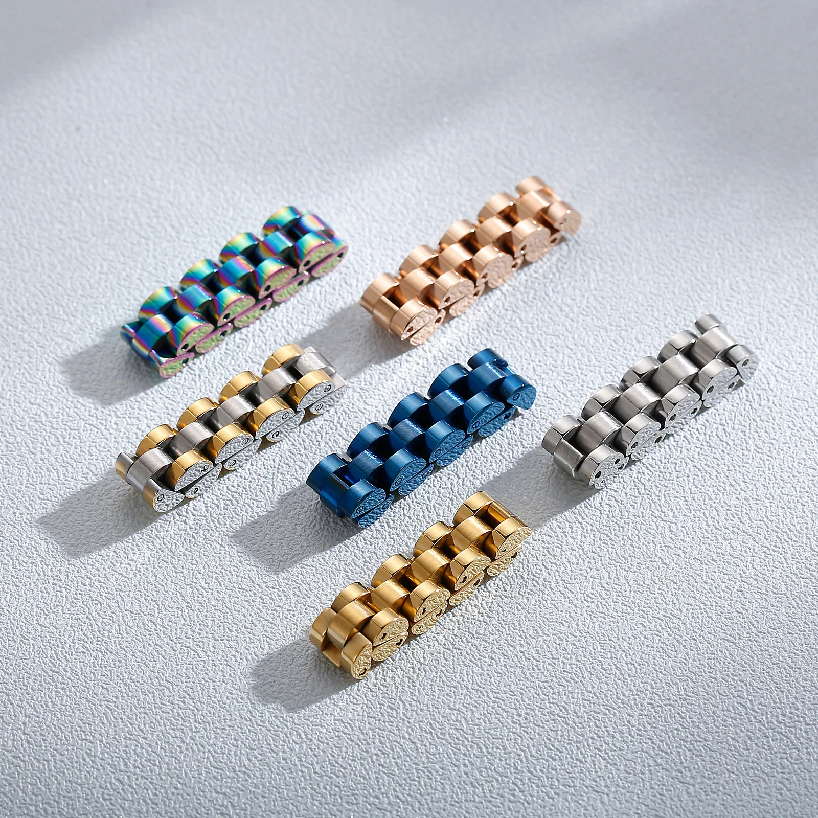 Vibrant rainbow-colored stainless steel bracelet with a sleek, modern design.