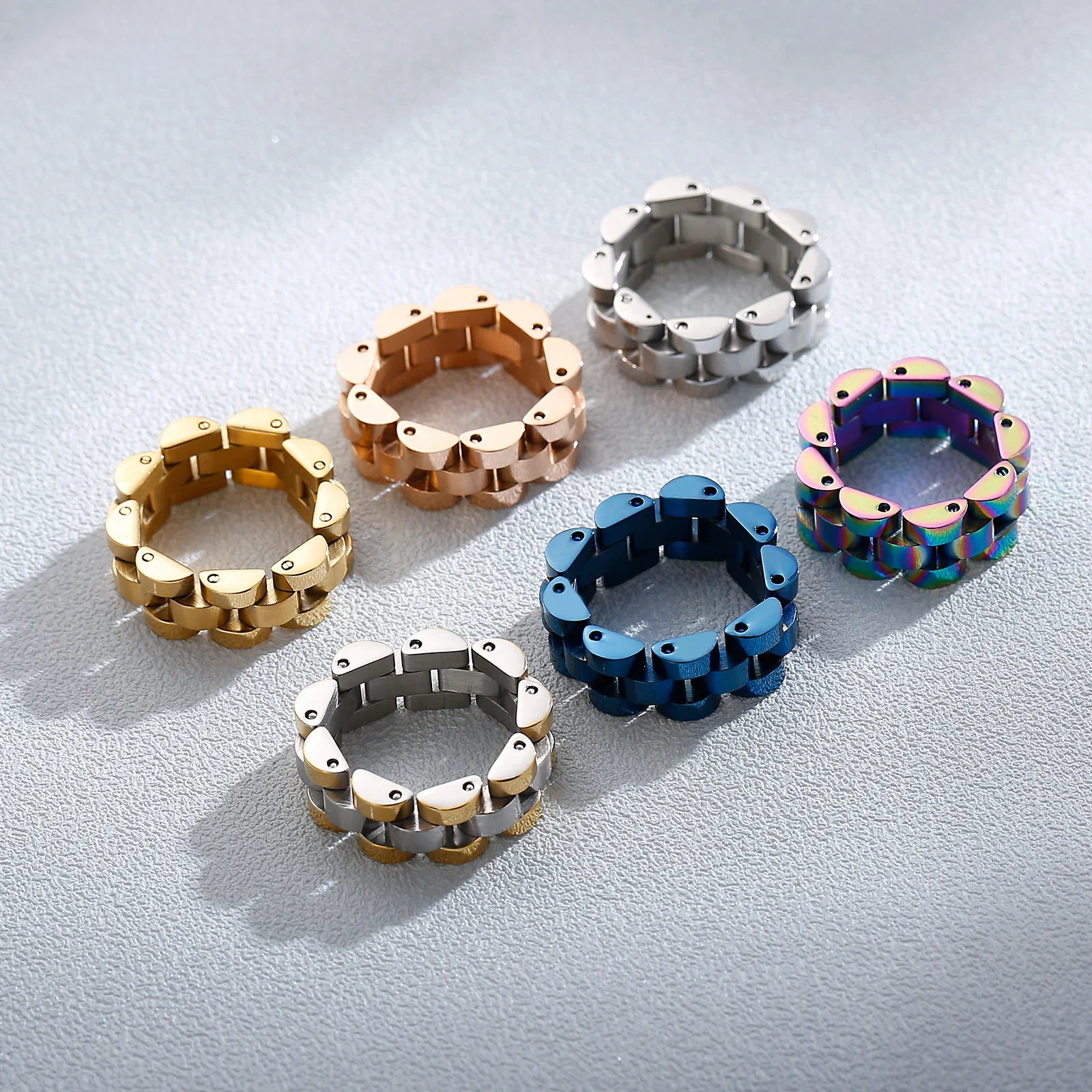 Brightly colored adjustable jewelry link rings for custom accessories.