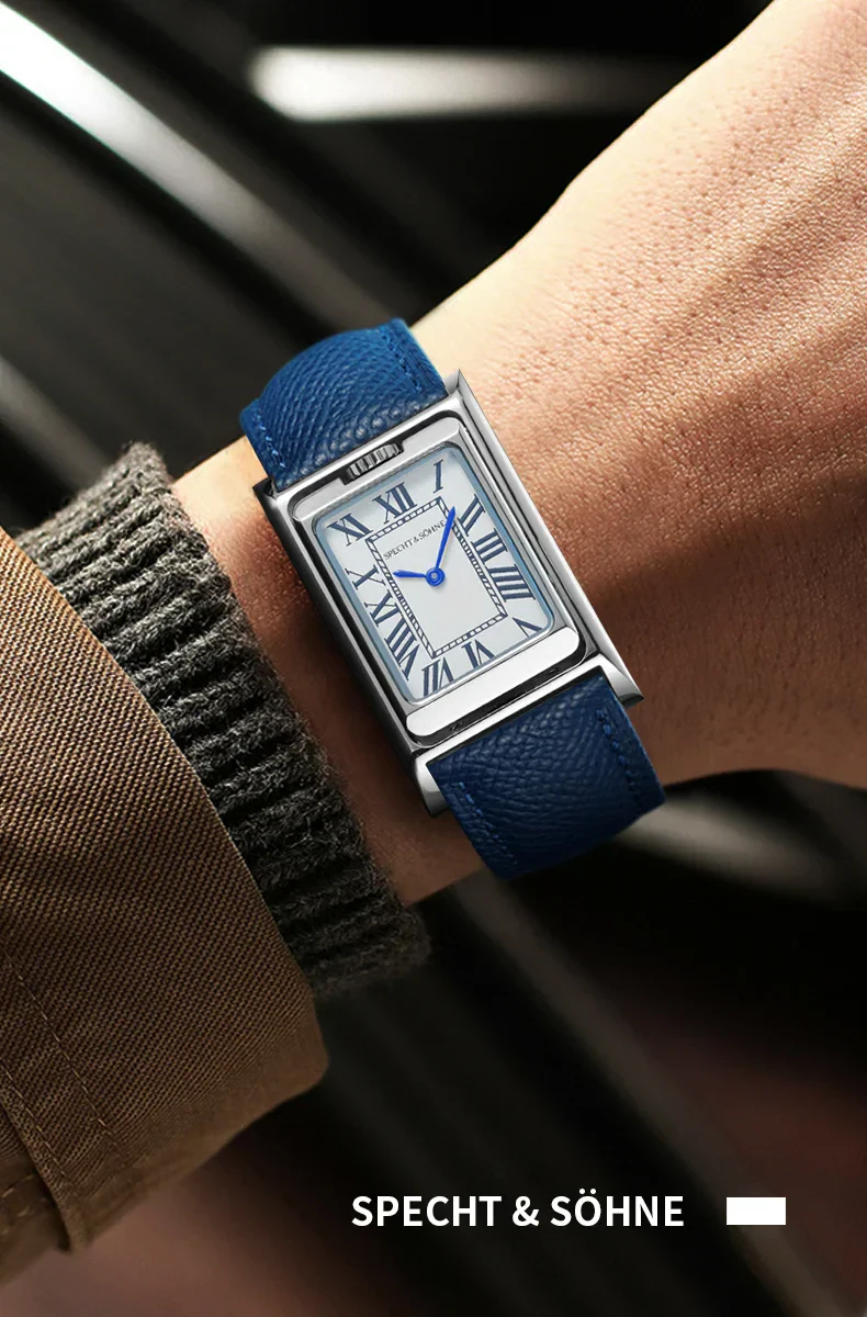 Luxury blue leather strap watch with Roman numeral dial and sleek silver case for men and women.
