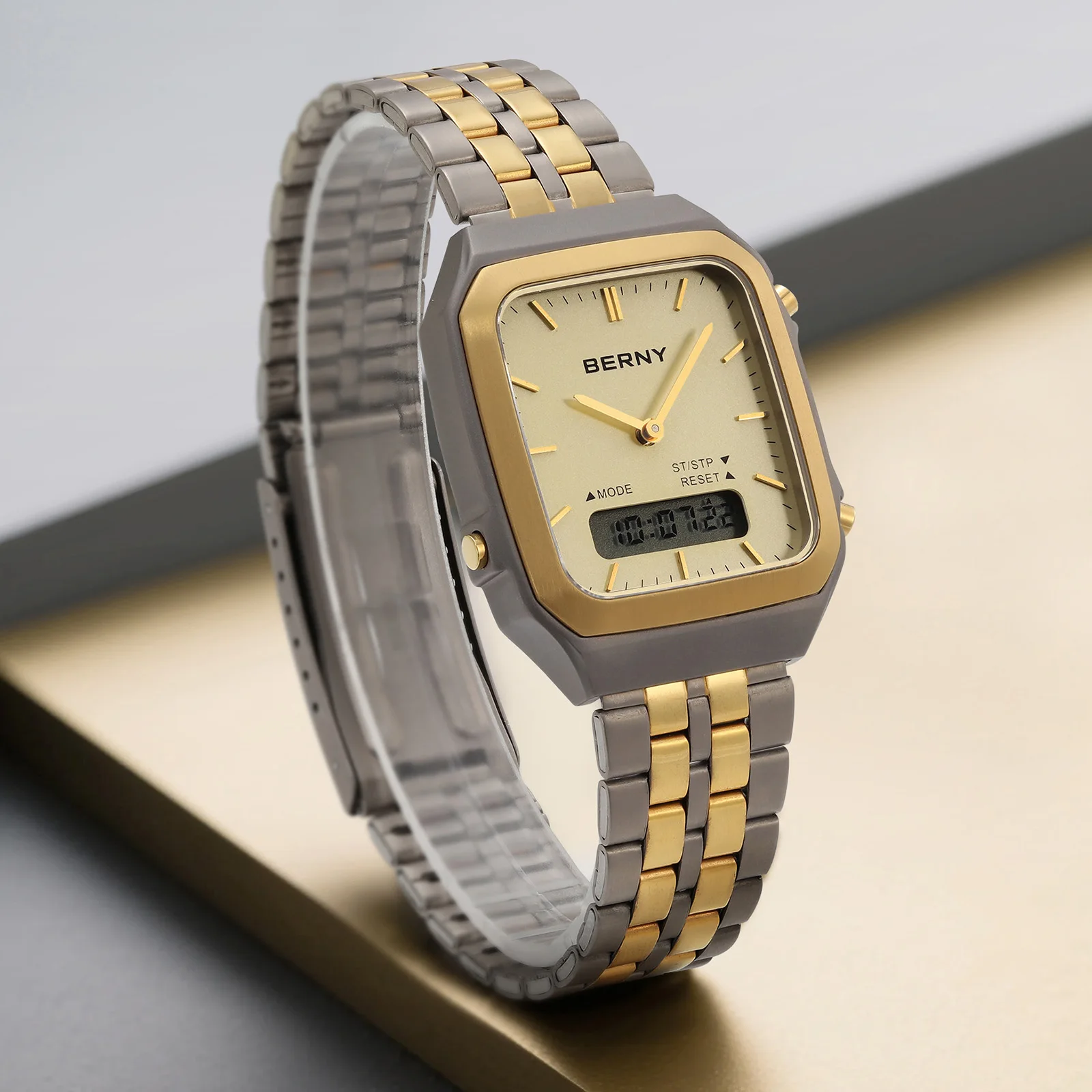 Elegant men's wristwatch with gold and silver tones, digital and analog display, perfect for fashion-forward accessories.