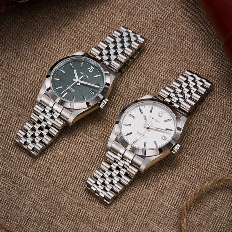 Elegant men's wristwatches with stainless steel bands and chronograph features.