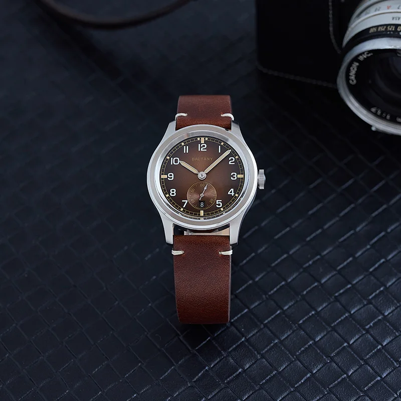 Stylish men's wristwatch featuring a brown dial, stainless steel case, and genuine leather strap for everyday wear.