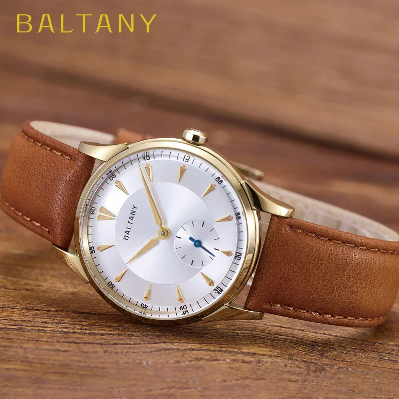 Elegant gold-tone watch with brown leather strap and minimalist design for men and women.