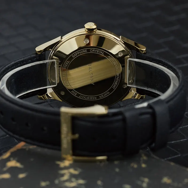Luxurious men's wristwatch featuring gold-tone case and black leather band, perfect for formal wear.