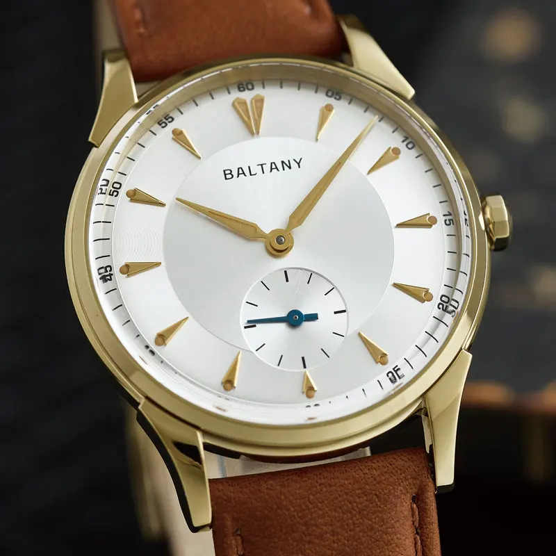 Luxurious gold wristwatch featuring a white dial, gold accents, and a brown leather band for men's fashion.