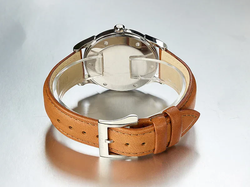 Elegant brown leather strap with stainless steel watch face. Perfect for men's casual and formal wear.