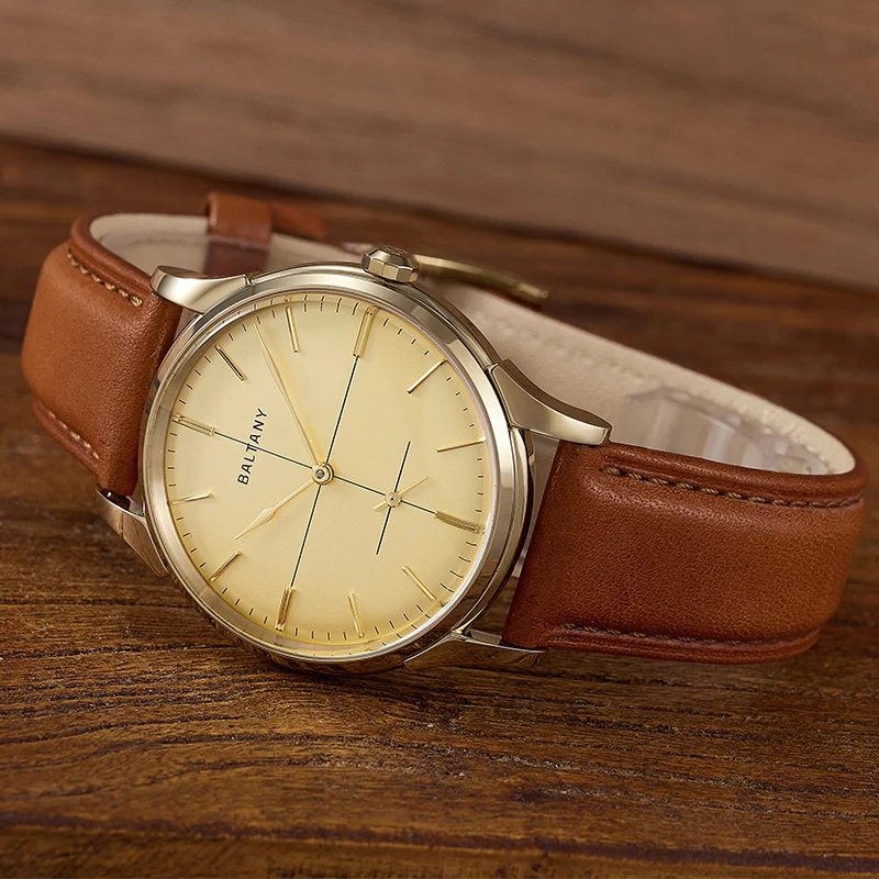 Elegant brown leather strap wristwatch with gold accents.