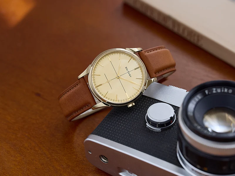 Elegant men's wristwatch featuring a brown leather band and sleek minimalist design.