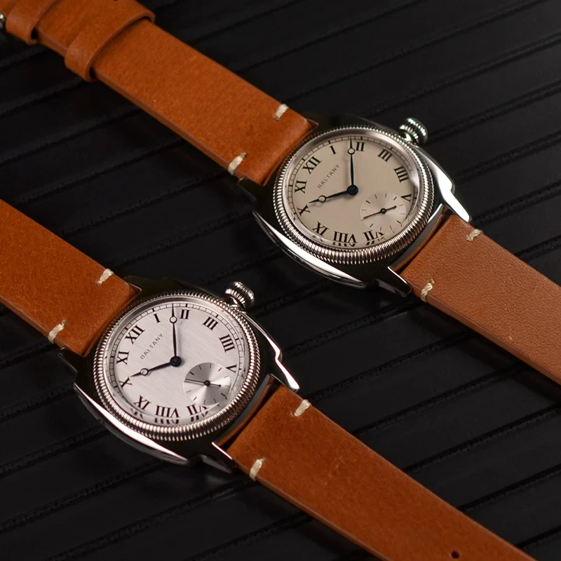 Elegant brown leather strap watches with silver dials and Roman numeral markers.