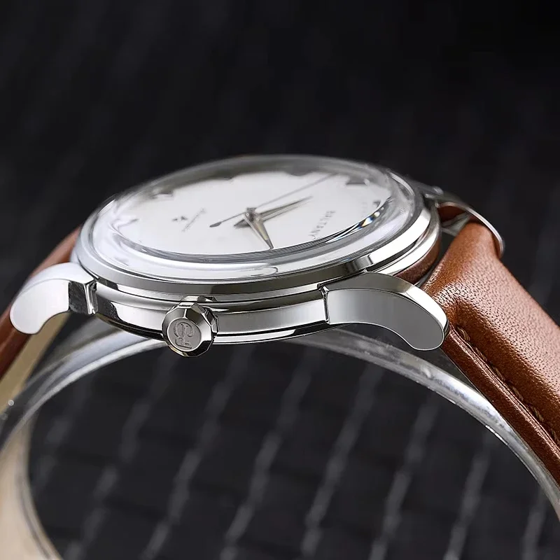 Elegant silver watch with brown leather strap for men.
