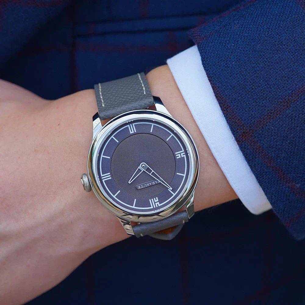 High-quality men's wristwatch featuring a black dial and grey leather strap, perfect for stylish occasions.
