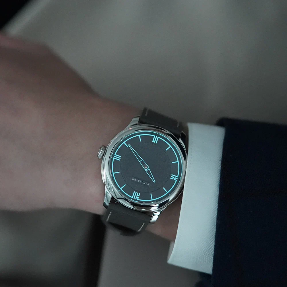 Elegant men's watch featuring a sleek black leather band and glowing blue accents for style and functionality.