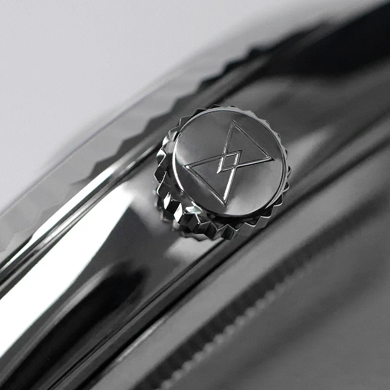 High-quality men's watch crown featuring engraved logo on sleek black dial.