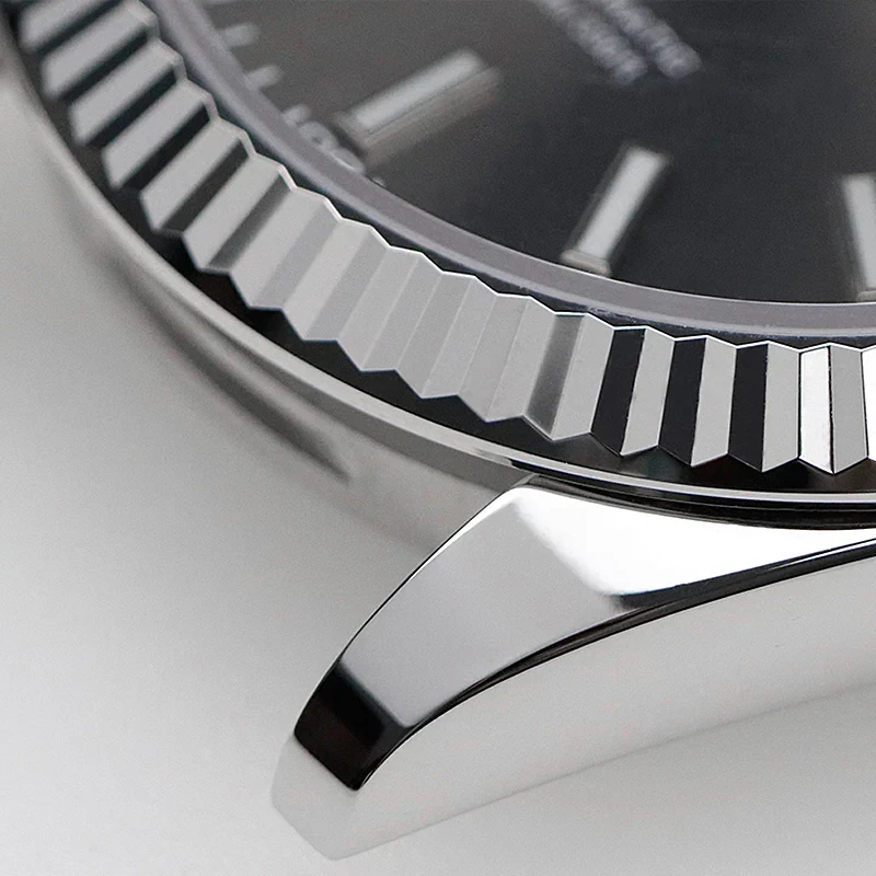 High-detail image of a luxury wristwatch with a sleek metal bezel and dark dial, perfect for jewelry and watch enthusiasts.