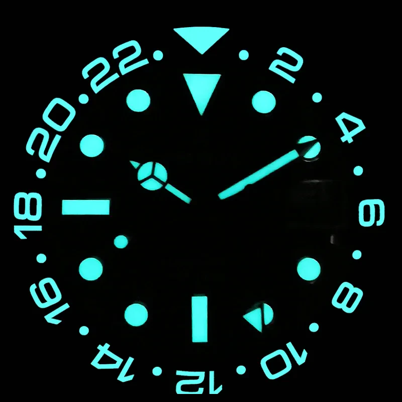 Glow-in-the-dark watch dial with luminous numbers and hands.