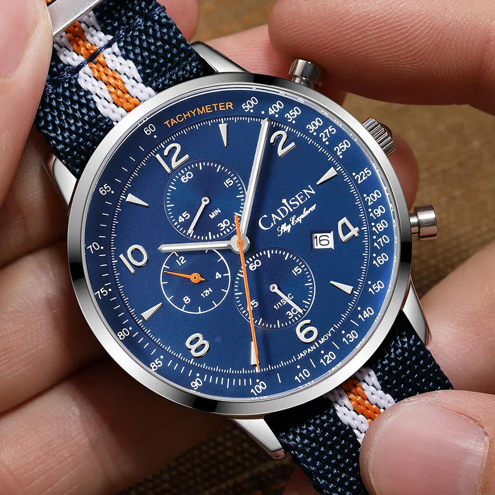 Men's stylish analog chronograph watch with blue dial and fabric strap featuring orange and white accents.