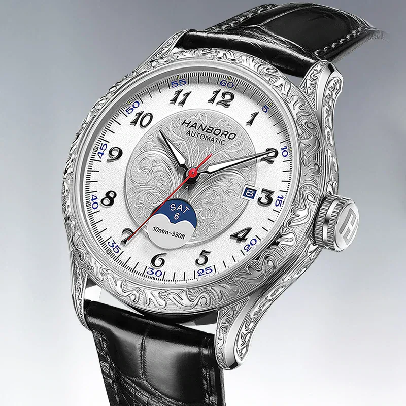 Elegant silver men's automatic watch with engraved case and black leather strap.