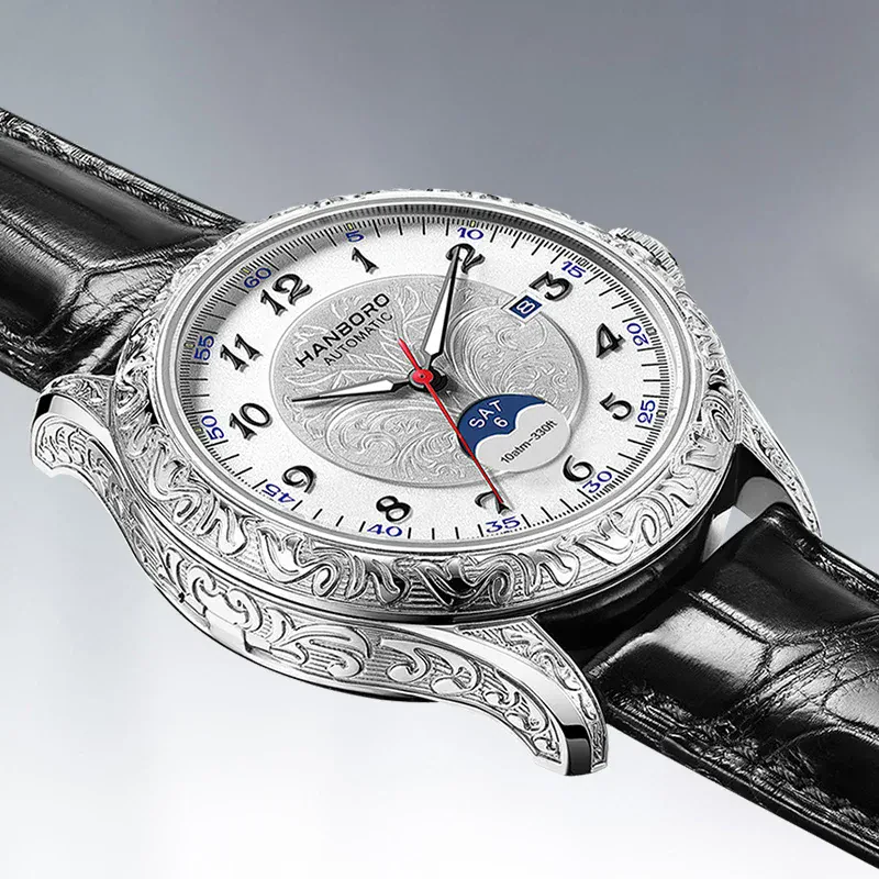 High-end men's wristwatch featuring engraved silver case, leather band, and day-date display.