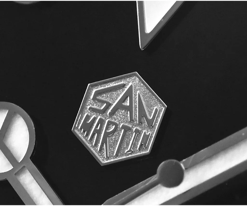 Close-up of San Martin Water Ghost watch logo on dial.