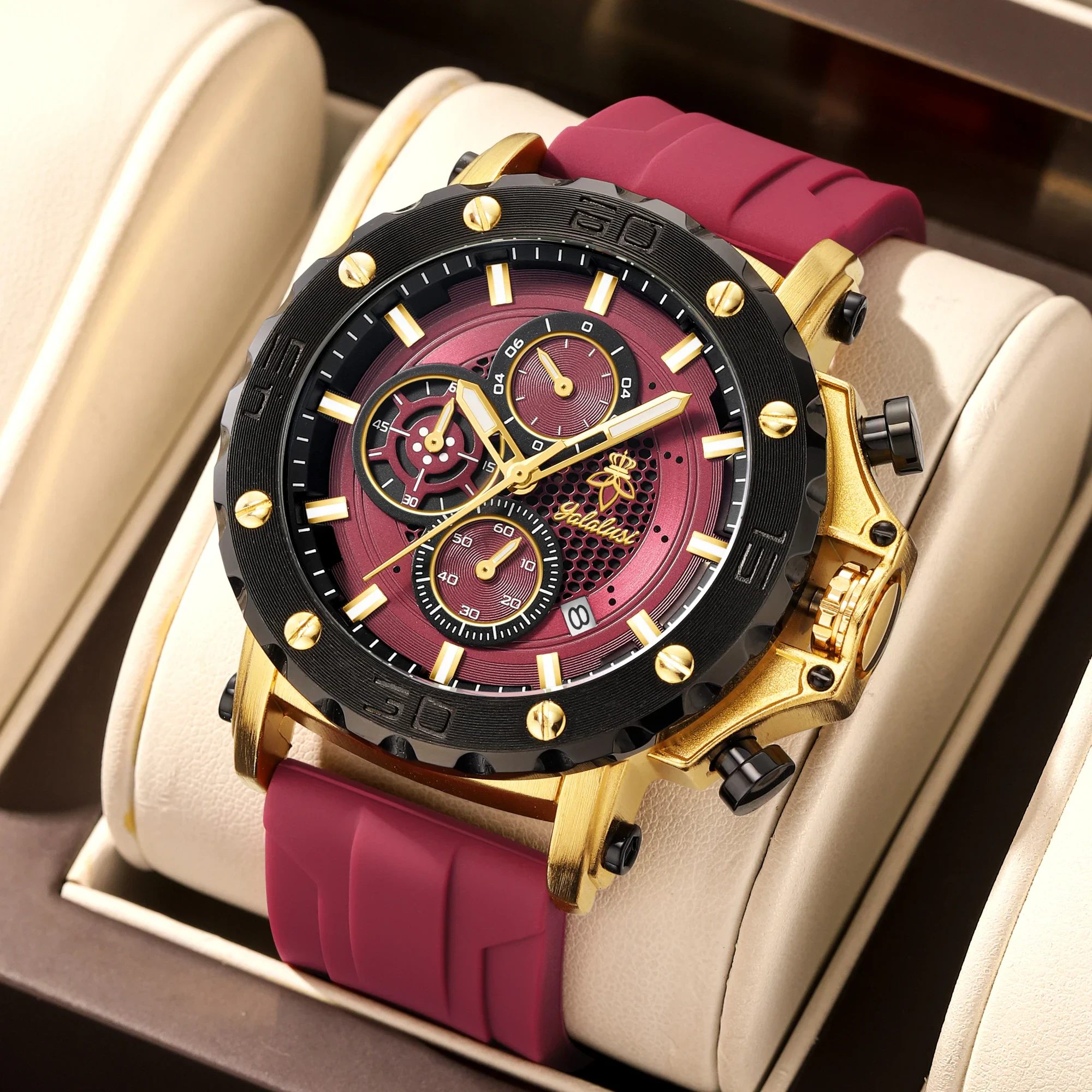 Men's bold and sporty chronograph watch with gold accents and a red strap.
