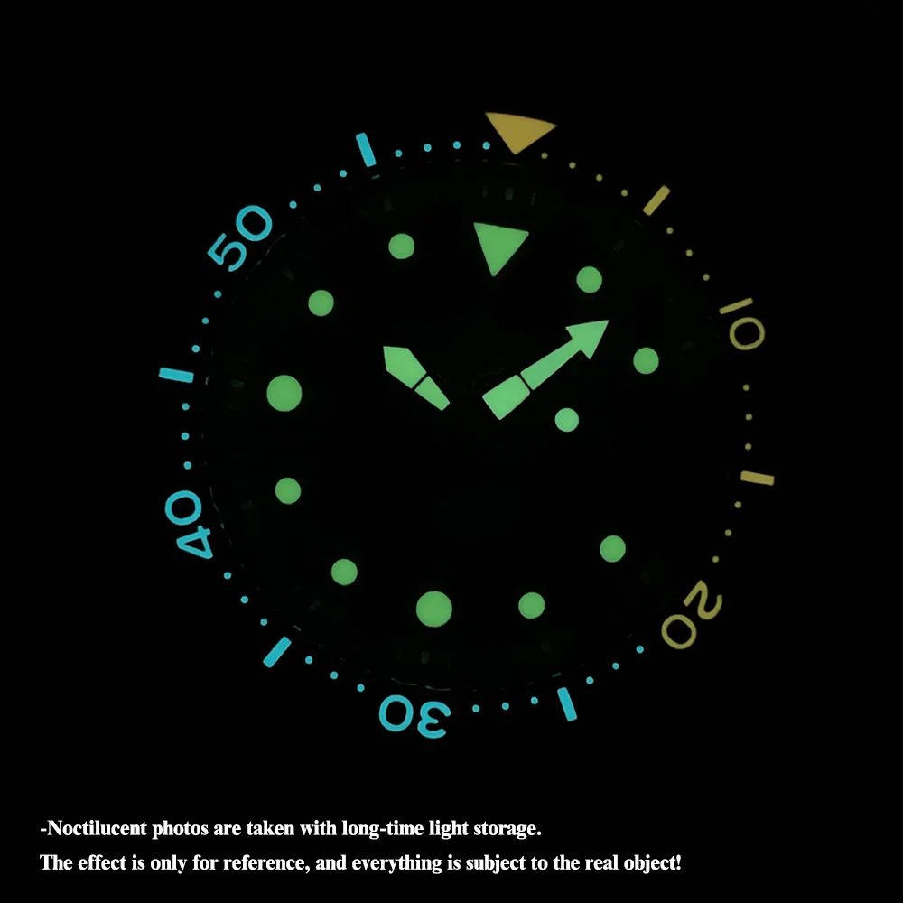 Luminous dive watch bezel with glow-in-the-dark markers for underwater visibility.