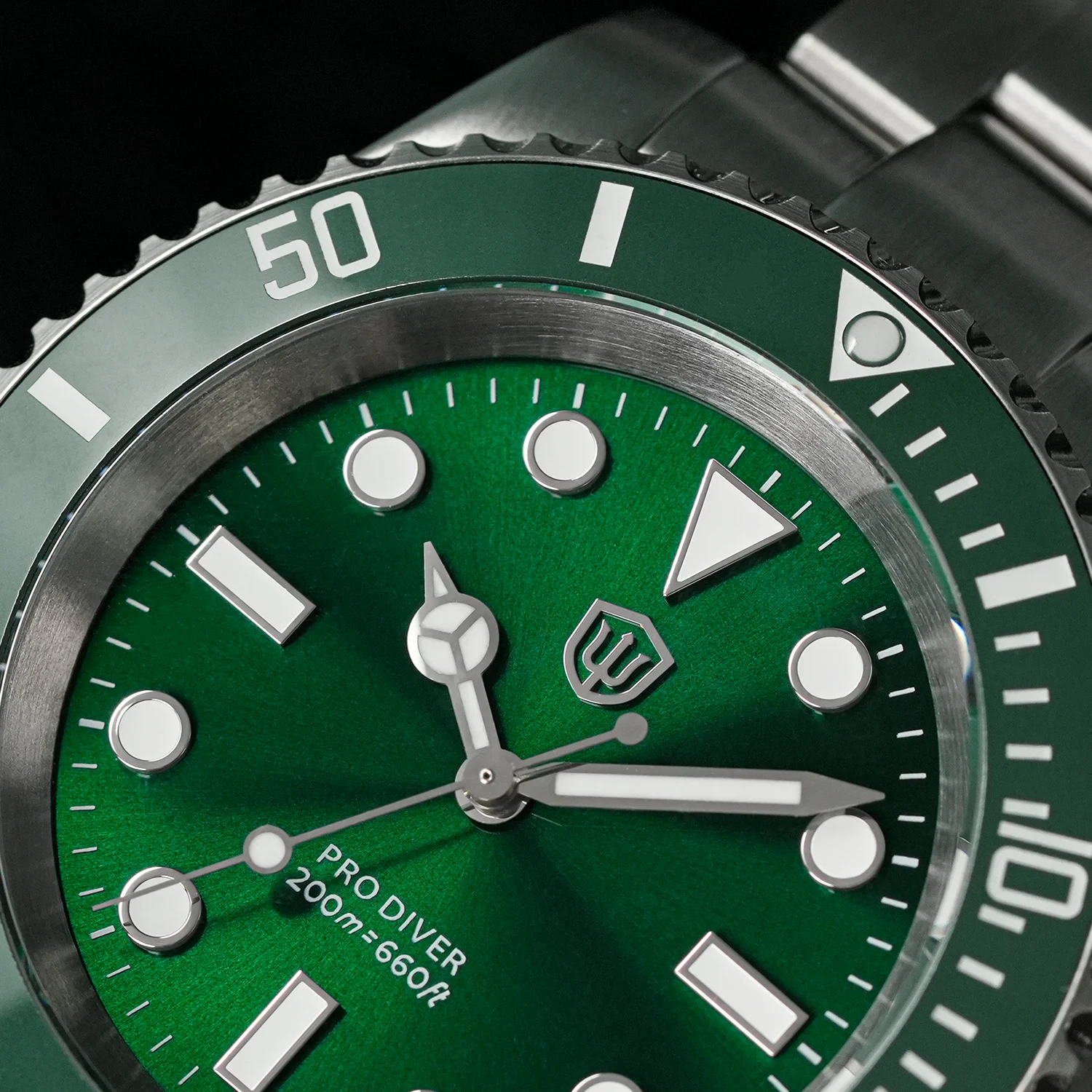 Diving watch featuring a vibrant green dial, ceramic bezel, sapphire crystal, and 200M water resista.