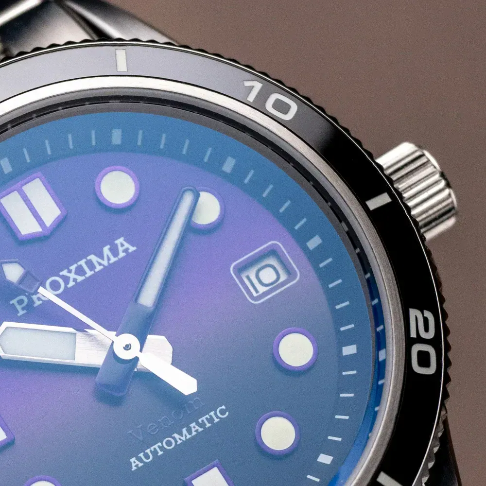 Automatic men's watch with sunburst blue dial and sapphire glass.
