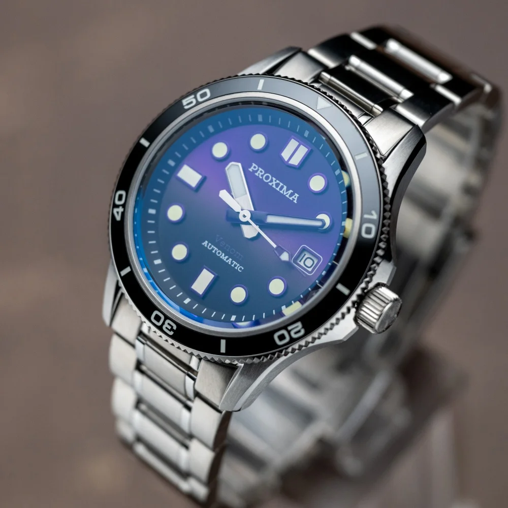Automatic men's diver watch with blue sunburst dial and ceramic bezel.