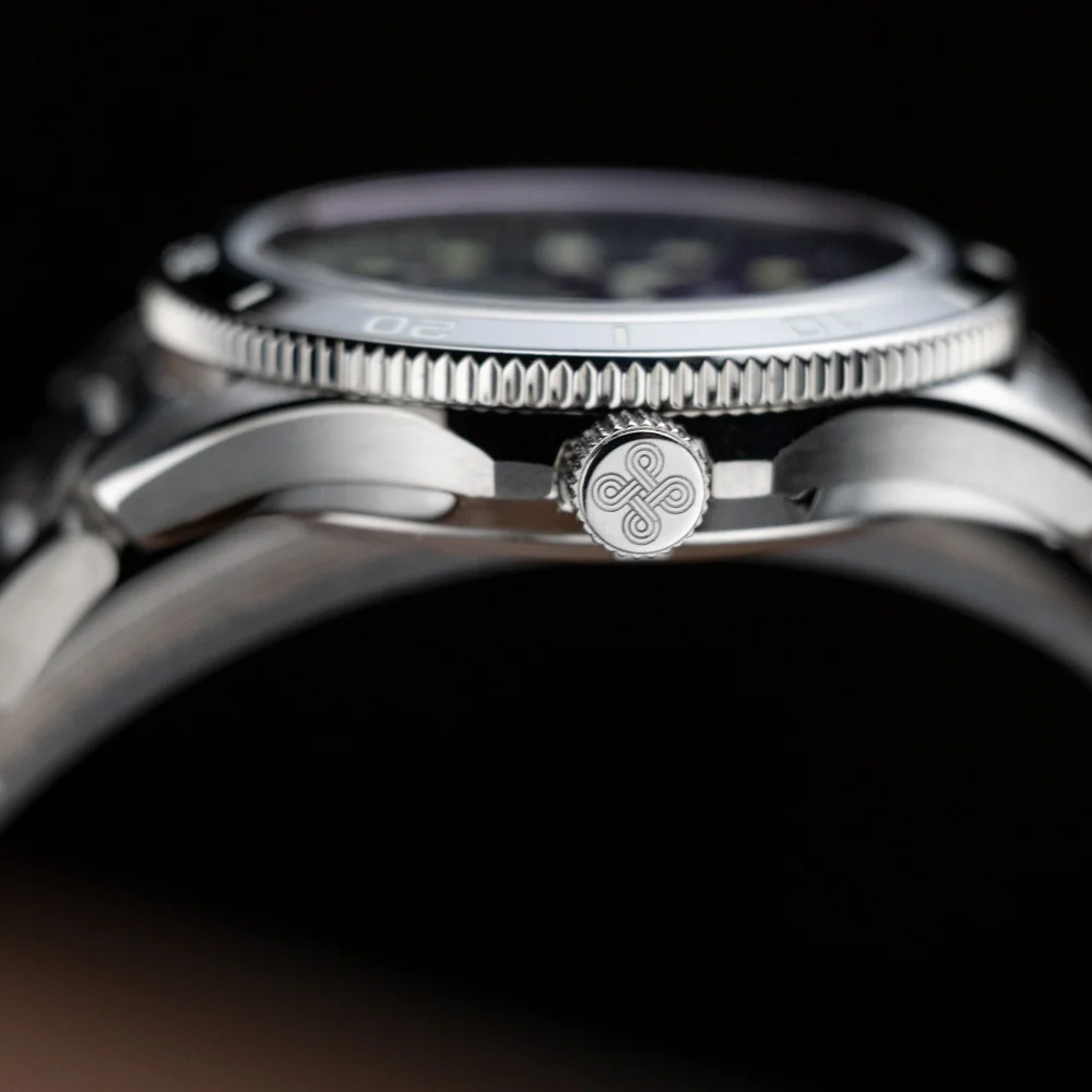Close-up of Proxima PX1747 men's automatic watch with ceramic bezel and luminous dial.