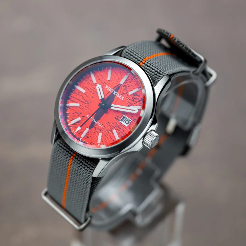 Luxury men's dive watch with luminous dial, 39mm case, automatic movement, and 100m water resistance.