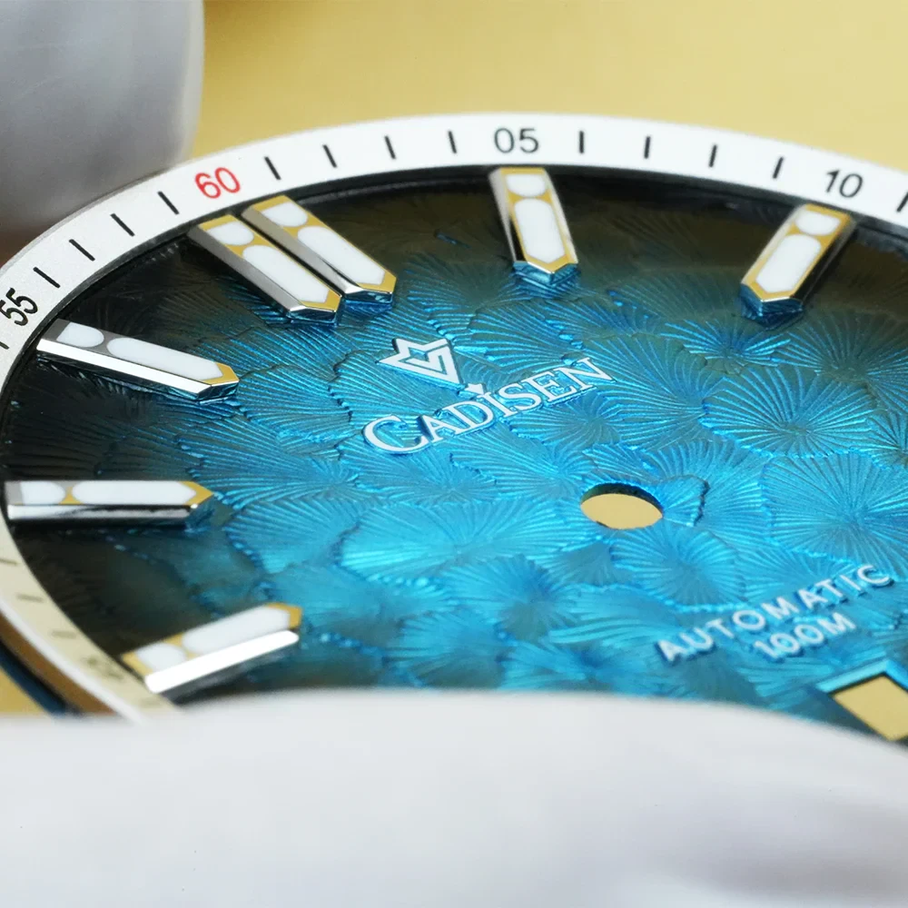 Automatic men's watch with blue textured dial and silver case.