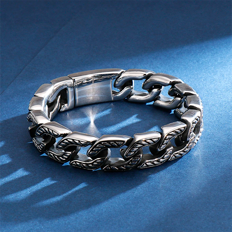 Men's stainless steel skull bracelet with bold chain links.