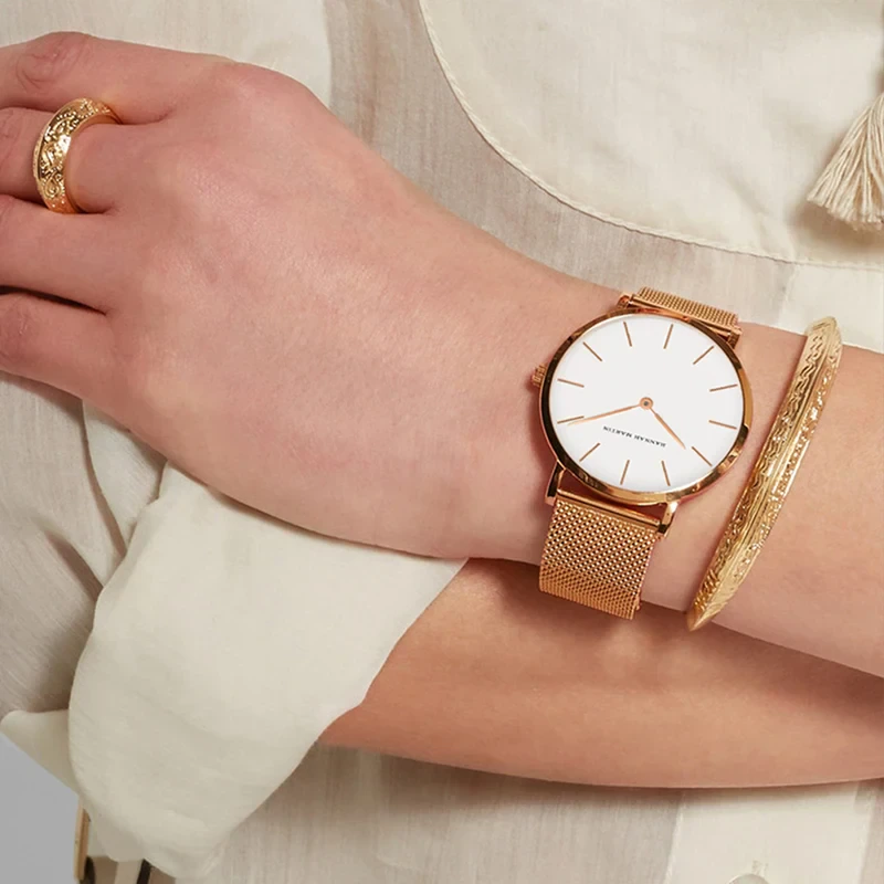 Elegant minimalist 36mm watch with matching gold bracelet. Perfect for stylish women.