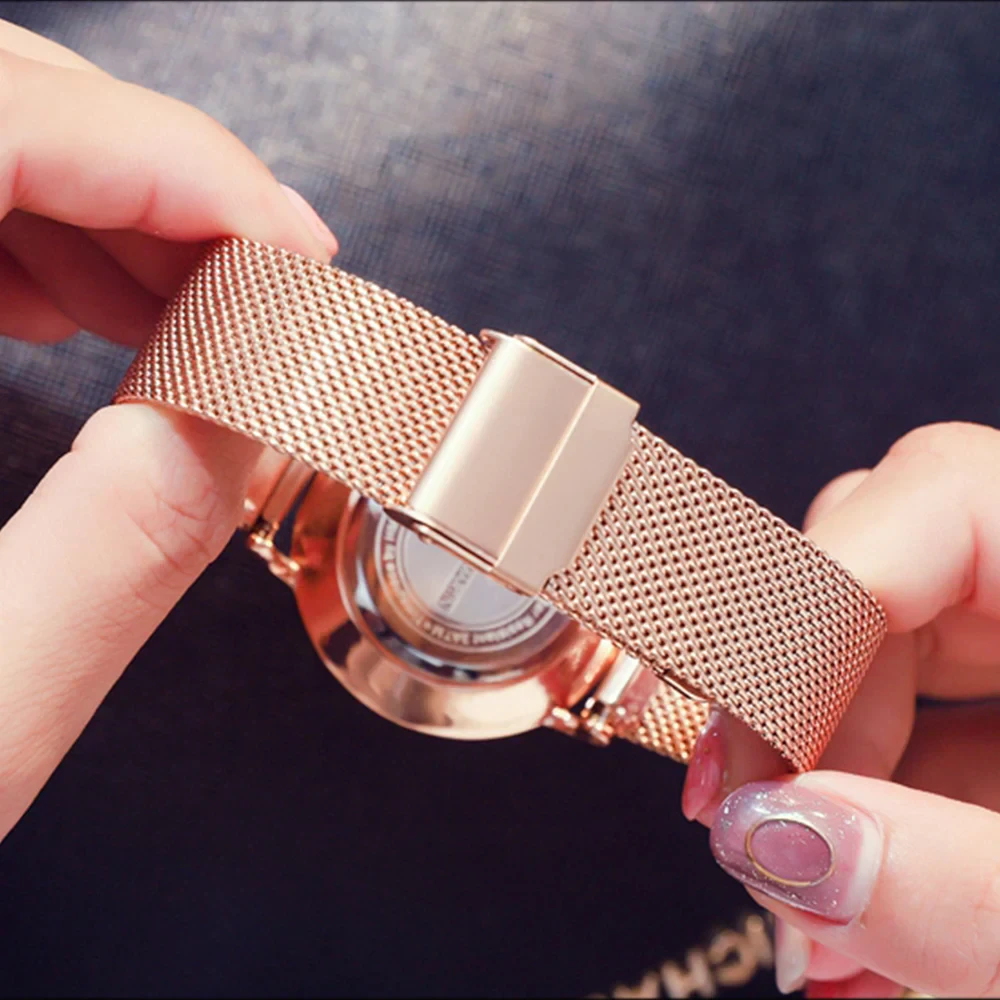 Elegant rose gold watch with matching bracelet, minimalist 36mm design.